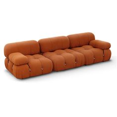 a brown couch sitting on top of a white floor