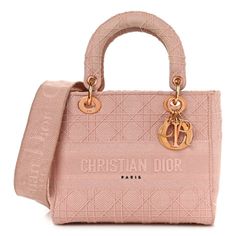 This is an authentic CHRISTIAN DIOR Canvas Embroidered Cannage Medium Lady D-Lite in Pink. This handbag tote is finely crafted of embroidered Cannage canvas with a 'Christian Dior' signature on the front and features fabric top handles and a shoulder strap with gold hardware, including a Dior letters charm. The top opens to a Dior monogram fabric interior with pockets. Designer Beige Shoulder Bag With Embroidered Logo, Luxury Bags With Embroidered Logo For Daily Use, Luxury Beige Shoulder Bag With Embroidered Logo, Luxury Shoulder Bag With Embroidered Logo For Daily Use, Designer Canvas Bags With Embroidered Logo, Designer Canvas Shoulder Bag With Embroidered Logo, Luxury Double Handle Shoulder Bag With Embroidered Logo, Luxury Shoulder Bag With Embroidered Logo And Top Handle, Elegant Top Handle Shoulder Bag With Embroidered Logo