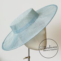 Boaters are all the rage, and this light blue sinamay fascinator version has us all in a twirl! Made from 2 layers of stiffened sinamay, these boaters are ready to trim and have a petersham ribbon on it's inside edge. Simply add a comb or headband to secure to the head.Hat base measures:Width: 37cm (14.5 inches)Crown Width: Measures 15.5cm (6.1 inches) wide at base and 14cm (5.5 inches) at top Crown Height: 4.5cm (1.7 inches)For even more millinery supplies you can find us here:www.etsy.com/shop Blue Panama Hat For Kentucky Derby, Blue Flat Brim Panama Hat For Kentucky Derby, Blue Adjustable Fascinator For Summer, Adjustable Blue Fascinator For Summer, Fitted High Crown Sun Hat For Spring, Fitted Mini Hat With Flat Brim For Kentucky Derby, Adjustable Blue Headpiece With Curved Brim, Adjustable Light Blue Hat With Curved Brim, Adjustable Flat Cap Hats For Summer