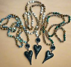 These beautiful handmade, knotted crystal and stone necklaces would be a perfect addition to your jewelry collection. Each are adorned with a black rhinestone pendant and hammered metal heart. The necklace is approximately 30 inches. Bohemian Handmade Heart Pendant Beaded Necklace, Handmade Heart-shaped Turquoise Necklace, Handmade Heart-shaped Bohemian Turquoise Necklace, Hammered Metal Jewelry, Bohemian Heart-shaped Metal Necklaces, Luxury Bohemian Heart-shaped Necklace, Turquoise Heart Necklace, Turquoise Heart, African Turquoise