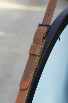 the leather strap is attached to the window