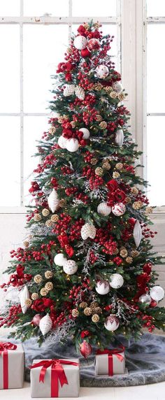 a decorated christmas tree with presents under it