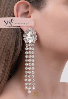 "Statement Earrings, LONG CHANDELIER EARRINGS, Long Swarovski Crystal Earrings, Bridal Chandelier Earrings, Bridal Chandelier Earrings Add a sophisticated, stylish glow to any outfit with these beautiful lightweight Swarovski crystal chandeliers. Details: ♥ U.S packages shipped via USPS® insured+USPS® tracking number ♥ 1-year guarantee ♥ Materials- 14k Gold or Silver Plated over brass CRYSTALLIZED™ Swarovski Element ♥ Posts on top ♥ Size approx (122mm h x 26mm w), (4.7\" h x 1\" w) ♥ Color Clear Bridal Chandelier Earrings, Swarovski Crystal Chandelier, Bridal Earrings Chandelier, Long Chandelier, Crystal Hair Comb, Crystal Chandeliers, Swarovski Crystal Earrings, Crystal Hair, Earrings Long