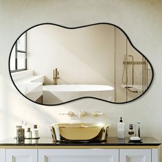 a bathroom with a sink, mirror and bathtub on the wall in it's corner