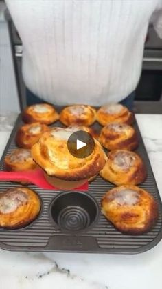 there is a muffin pan filled with pastries