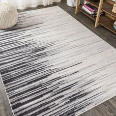 a white rug with black and grey stripes