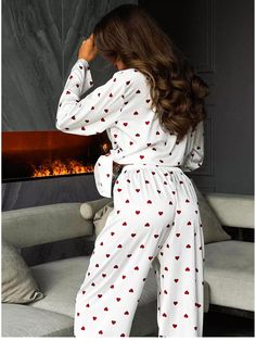 Indulge in luxury and comfort with our Luxurious Heart Print Long Sleeve Long Pajama Set. Crafted with a soft and smooth feel, this two-piece ensemble features charming heart prints that add a touch of romance to your bedtime routine. The long-sleeve top and matching long pants offer full coverage and warmth, perfect for cozy nights in. Elevate your sleepwear collection with this exquisite set designed for style and relaxation.Key Features:Romantic Design: Adorned with adorable heart prints, this pajama set adds a romantic flair to women's loungewear collection, perfect for expressing your affectionate side.Comfortable Fabric: Made from high-quality materials with a smooth and silky surface, this pajama set offers a luxurious feel against the skin, ensuring ultimate comfort and relaxation. Long Sleeve Heart Print Sleep Set, Heart Print Long Sleeve Pajama Party Sets, Heart Print Long Sleeve Sleepwear For Pajama Party, White Long Sleeve Sleepwear With Heart Print, Casual Heart Print Pajama Party Sets, Casual Heart Print Sets For Pajama Party, Feminine Long Sleeve Lounging Sets, Casual White Sets With Heart Print, White Heart Print Sleepwear For Pajama Party