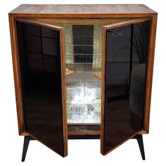 an old wooden cabinet with glass doors on the top and bottom, in front of a white background