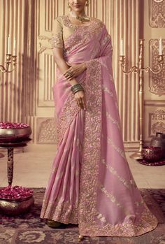 This saree is made of high-quality silk and features intricate embroidery, making it a unique and elegant garment. The deep hue is sure to make a statement and is perfect for special occasions. Crafted with skill and care, this saree is sure to turn heads. Stitching Option - We will email you the measurement guide to confirm your size. FABRIC: Fancy Silk SAREE FABRIC SIZE: 5.5 Meters BLOUSE FABRIC SIZE: 0.80 Meters SHIPPING: The product will be shipped within 1 - 2 weeks from the date of purchas Luxury Georgette Women's Saree, Affordable Designer Saree For Eid, Cheap Elegant Saree For Eid, Cheap Elegant Women's Saree, Cheap Traditional Saree For Eid, Affordable Traditional Pattern Saree For Eid, Affordable Traditional Georgette Saree, Cheap Cutdana Saree For Eid, Embroidery Blouse Saree