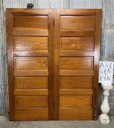 two large wooden doors sitting next to each other