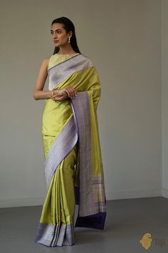 "An\u00a0everlasting saree\u00a0with\u00a0artistic patterns and a striking contrast of\u00a0colours. The border features delicate vines, laced with leaves crafted in gold and silver zari. Woven in the finest Kadiyal style, this is\u00a0the hallmark of\u00a0Banarasi textile art.\n\u00a0\n\n\nColor\u00a0-\u00a0A\u00a0stunning shade of Pear Green with a contrast\u00a0Purple border and aanchal.\n\nTechnique\u00a0-\u00a0True to form\u00a0Kadiyal technique which\u00a0helps achieve a border in a sharpl Artistic Patterns, Banaras Sarees, Beautiful Sarees, Leaf Crafts, Saree Trends, Katan Silk, Beautiful Saree, Handloom Saree, Blouse Piece