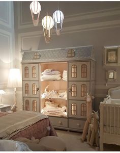 a doll house in the corner of a bedroom