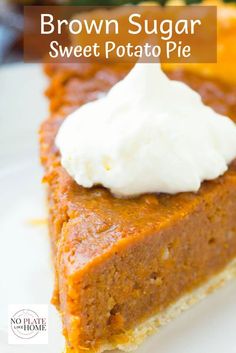 a slice of brown sugar sweet potato pie on a white plate with whipped cream on top