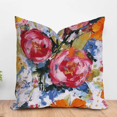 a pillow with flowers painted on it