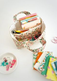 a bunch of crafting supplies sitting next to each other on a white counter top