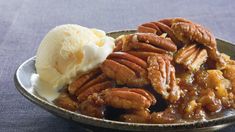 pecans and ice cream are on a plate