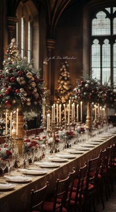 a long table is set with christmas decorations and candles for an elegant holiday dinner party