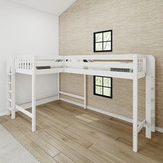 two white bunk beds sitting next to each other on top of a hard wood floor