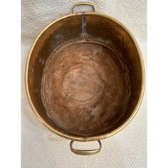 an old metal pot with some rust on it