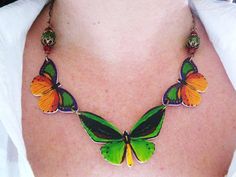 Butterfly Necklace Pretty Summer Green Red and by whatanovelidea, $38.00 Multicolor Butterfly Charm Necklaces, Handmade Green Butterfly Necklace, Multicolor Butterfly Charm Jewelry, Multicolor Butterfly Print Jewelry Gift, Unique Multicolor Butterfly Jewelry, Multicolor Butterfly Jewelry For Gifts, Multicolor Butterfly Jewelry Gift, Multicolor Adjustable Butterfly Necklace For Gift, Adjustable Multicolor Butterfly Necklace Gift