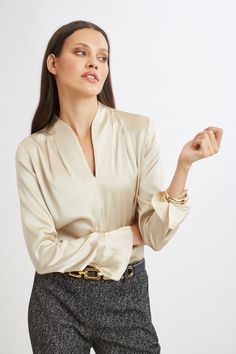 Effortlessly chic, this shirt is destined to become a favorite. Luxurious Silk Satin elevates this minimalist top. With its contour neckline, soft pleat detail & tiered ruffle cuffs, this essential piece will take you from Fall to Spring. Elie Tahari Exclusive Long Sleeve Contour Neck Ruffle Shirt 93% Silk 7% Elastane Runs true to Size Length From Shoulder to Hem: Back 27.25"L, Sleeve: 32.5"L (approx. length for size S) Model is 5'9" and wearing size XS Dry Clean Only Imported Style #: E9053524 Minimalist Top, Shirt Cuff, Jumpsuit Jacket, Ruffle Shirt, Long Sleeve Short Dress, Elie Tahari, Neck Ruffle, Knit Tees, Denim Coat