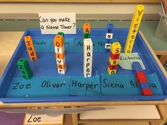 a blue tray with letters and blocks on it