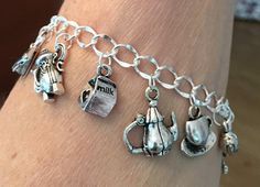 Silver Tea Charm Bracelet – Roses And Teacups Silver Novelty Charm Bracelet Gift, Novelty Silver Charm Bracelet Gift, Silver Novelty Bracelets With Charms, Silver Novelty Charm Bracelet, Silver Novelty Charm Bracelet As A Gift, Silver Metal Novelty Bracelets, Novelty Silver Metal Charm Bracelet, Silver Novelty Metal Charm Bracelet, Novelty Silver Hypoallergenic Charm Bracelet