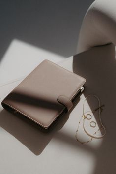 a wallet sitting on top of a white table