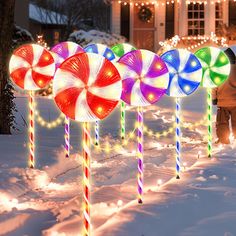 PRICES MAY VARY. 【Large 28 Inch Outdoor Christmas Lollipop Light with Light Strip】: This is a upgraded Christmas light featuring large lollipop shapes above the candy canes. Each light is connected by light strips in between, each interval has 10 LED, each lollipop light has 20 LED, super bright, add a romantic and cozy touch to your holiday display. 【230 Super Bright LED】: Featuring with 230 bright warm white LED lights, 14 LED of each lollipop topper, 6 LED of each post, 10 LED of each light s Candyland Christmas Decorations Outdoor, Christmas Lollipop Decorations, Christmas Lights Inside, Christmas Pathway Lights, Snowflake Christmas Lights, Lollipop Decorations, Large Lollipops, Candy Decorations Diy