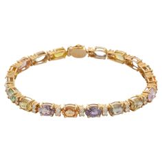 Bracelets are worn to enhance the look. Women love to look good. It is common to see a woman rocking a lovely gold bracelet on her wrist. A gold gemstone bracelet is the ultimate statement piece for every stylish woman. Adorn your wrist with this beautiful multi-sapphire and diamond prong set charm bracelet in 14 Karat Gold. Each piece is handmade with a unique shape of precious stone. This elegant and lightweight bracelet is perfect for everyday wear. PRODUCT DETAILS :- Material - 14K Solid Yel 14k Yellow Gold Multi-stone Bracelet, Gold Multi-stone Tennis Bracelet, Yellow Gold Multi-stone Tennis Bracelet, Luxury Multi-stone Gold Bracelet, Luxury Yellow Gold Multi-stone Bracelet, Sapphire Tennis Bracelet, Bracelet With Diamonds, Red Sapphire, Bracelet Tennis