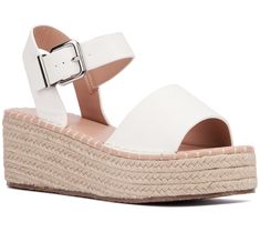 Elevate your summer style with the Elandra. These sandals blend the classic charm of espadrilles with a modern silhouette, finished with polished buckles for a touch of elegance. Perfect for sunny days and balmy nights, they're a versatile addition to any wardrobe. From New York & Company. Modern Wedge Sandals For Spring Vacation, Modern Sandals With Woven Sole For Summer, Modern Woven Sole Sandals For Summer, Modern Wedge Sandals With Buckle For The Beach, White Espadrilles With Removable Insole For Summer, Summer Wedge Sandals With Buckle Closure For Day Out, White Espadrille Sandals For Summer, Summer Wedge Sandals With Buckle For Day Out, Modern Beach Wedge Sandals With Buckle Closure