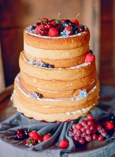 a cake with berries and icing on top