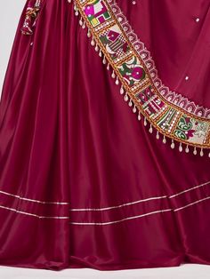 Introducing our amazing maroon gamthi work silk navratri wear lehenga choli, made with maroon satin silk material. This stunning ensemble is perfect for traditional occasions like Navratri, where you want to look elegant and festive.
Let's talk about the benefits of this beautiful lehenga choli. It is made with high-quality satin silk material, ensuring a smooth and comfortable fit. The maroon color adds a touch of sophistication and grace to the overall look. The gamthi work on the choli and at Burgundy Anarkali Dupatta For Festivals, Burgundy Traditional Wear With Dupatta For Festivals, Traditional Burgundy Dupatta For Festive Season, Traditional Burgundy Wear For Festive Occasions, Burgundy Zari Work Sets For Diwali, Navratri Satin Choli With Traditional Drape, Navratri Satin Sets With Zari Work, Satin Choli For Navratri With Traditional Drape, Bollywood Burgundy Dupatta With Zari Work