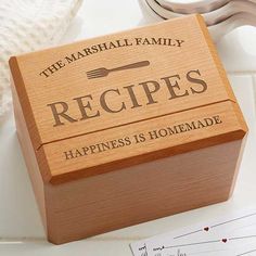 a wooden box that says, the marshall family recipes happiness is homemade on top of a table