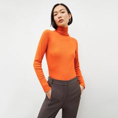 Made from super-soft Peruvian Pima cotton, this fine-ribbed turtleneck is a cool-weather wardrobe staple. Thanks to a fitted silhouette, it’s the perfect thing to layer under blazers and sweaters or tuck into high-waisted pants and skirts . Made in Peru with fabric from Peru. Ribbed Collar Turtleneck For Fall Workwear, Solid Fine Knit Turtleneck For Fall, Fall Workwear Turtleneck With Ribbed Collar, Fall Ribbed Collar Turtleneck For Work, Fall Turtleneck With Ribbed Collar For Work, Spring Solid Turtleneck With Ribbed Cuffs, Spring Ribbed Cuff Turtleneck, Spring Neutral Colored Turtleneck With Ribbed Cuffs, Second-skin Turtleneck For Fall Layering