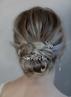 A dazzling set of 5 "champagne bubble" shaped hair pins. These pins feature dozens of Austrian crystals and can be worn sprinkled throughout your bun or braid for a custom bridal look. Adorned portion measures approximately: Large - 2 3/4 inches at its longest by 1 inches at its widest, 2 Medium pins - 1 1/2 inches at its longest by 1/2 inches at its widest, 2 Small pins - 3/4 inches at its longest by 1/2 inches at its widest Set of 5 pins and combs Austrian crystals Finished on gold or silver p Gorgeous Wedding Dress Princesses, Princess Bridal Gown, Champagne Bubbles, Most Beautiful Wedding Dresses, Comb Set, Amazing Wedding Dress, Crystal Hair Comb, Hair Care Brands, Favorite Hairstyles