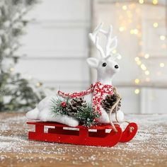 a toy sleigh with a reindeer on it