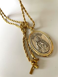 Embrace the power of faith with our San Judas Long Necklace. Made of stainless steel and gold plating, this twisted link chain represents strength and resilience. Wear it as a daily reminder of your unwavering beliefs and let it inspire you to overcome any challenge that comes your way. A statement piece for the faithful soul! Rope Chain Jewelry With Oval Links As A Gift, Spiritual Rope Chain Necklace, Spiritual Yellow Gold Jewelry With Rope Chain, A Daily Reminder, Gift Card Sale, Daily Reminder, Ring Bracelet, Earring Necklace, Link Chain