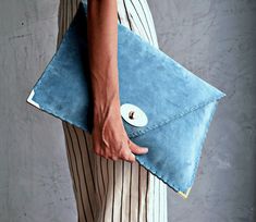 "Soft Symmetria Clutch in jeans blue. The perfect bag for all occasions! Ideal for cocktail and parties or for business meetings depending the size you choose. It comes in two sizes, small and large. You can use it as a chic briefcase for your work or as a modern large clutch for a night out. This adorable large clutch is handmade out of a genuine, lux Italian jeans blue suede leather. -Small size fits all your essentials, wallet, keys, mobile, cosmetics etc. -Large size fits a 15\" laptop, ipad Blue Rectangular Clutch For Everyday, Blue Envelope Clutch For Everyday Use, Chic Blue Everyday Clutch, Modern Blue Pouch Clutch, Modern Clutch, Formal Bag, Teal Blue Color, Suede Clutch, Large Clutch