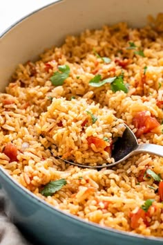 a large pot filled with rice and vegetables