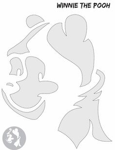 the paper cut out of winnie the pooh's face is shown in grey and white