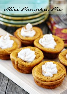 mini pumpkin pies with whipped cream on top