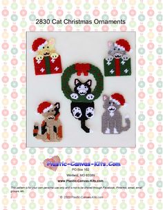 a cross stitch christmas ornament with cats and presents on it, in the shape of a wreath