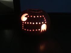 a carved pumpkin with holes in the middle