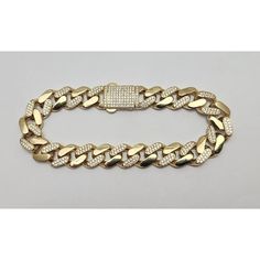 Unique 14K Karat Solid Yellow Gold  Designer Cuban CZ Link Bracelet  Condition : Pre-Owned Professionally Polished to look New Total Weight : 19.8 Grams Gold Color : Yellow Gold  Length : 7.75" Inches or 19.7cm Bracelet Thickness : 10.6mm x 3.8mm Bracelet Includes Cubic Zirconia's (Please See Pictures for more detail on the Sizes; they are by Millimeter) What you see in the pictures is what you will receive. Gold Iced Out Diamond Bracelet For Formal Occasions, Gold Iced Out Bracelets For Formal Occasions, Gold Diamond Bracelet With Cuban Link For Formal Occasions, Formal Gold Diamond Bracelet With Cuban Link, Luxury Yellow Gold Cuban Link Bracelet For Everyday, Iced Out Gold Bracelet For Formal Occasions, Gold Tennis Bracelet With Diamond Accents And Cuban Link, Formal Cuban Link Bracelet With Diamond Accents In Gold, Gold Cuban Link Bracelet With Cubic Zirconia