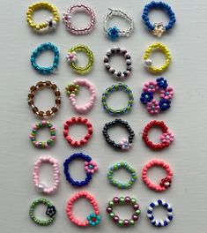 Colourful, funky and bold rings, made with seed beads and stretchy string. Handmade with love and care! Please feel free to message me for any colour combos / ring designs that I may not have included, I make these to order so open to any ideas :) Two tone designs, flowers and pearl rings that can be worn daily with any outfit! These would also make the perfect gift! <3 Cheap Beaded Flower Ring For Jewelry Making, Adjustable Multicolor Rings With Tiny Beads, Playful Handmade Multicolor Rings, Colorful Beads Flower Ring Gift, Adjustable Multicolor Flower Ring With Colorful Beads, Adjustable Multicolor Flower Ring With Beads, Handmade Multicolor Cute Rings, Handmade Multicolor Flower Rings, Adjustable Multicolor Beaded Flower Ring