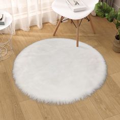 a white round rug in the middle of a room