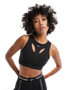 Sportswear by Nike Training Get the right support Round neck Nike logo print Cut-out panels Pull-on style High Stretch Sporty Sports Bra For Events, High Stretch Sports Bra For Sports Events, Black Gym Activewear With Medium Bust Support, Black Activewear With Medium Bust Support For Sports, Black High Stretch Sports Bra With Mesh Back, Sweat Resistant Activewear For Sports Events, Sporty Activewear With Medium Bust Support For Sports Events, Black Sports Bra With Go-dry High Stretch, High Stretch Black Sports Bra With Go-dry