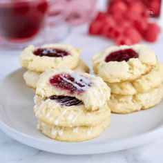 cookies with jelly filling on a white plate