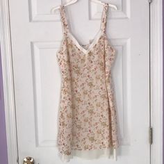 Cream And Floral Sundress With Cream Slip Underneath. Light Material That Is Perfect For Summer! Zipper In Back And Falls To Mid Thigh. Never Worn. Urban Outfitters White Floral Print Dress, Urban Outfitters White Floral Mini Dress, Feminine Sleeveless Dress By Urban Outfitters, Urban Outfitters Sleeveless Mini Dress With Floral Print, Urban Outfitters Sleeveless Floral Print Mini Dress, Urban Outfitters Elegant Floral Print Dress, Elegant Floral Print Dress By Urban Outfitters, Urban Outfitters Sleeveless Dress With Lace Trim, Sleeveless Lace Trim Dress From Urban Outfitters